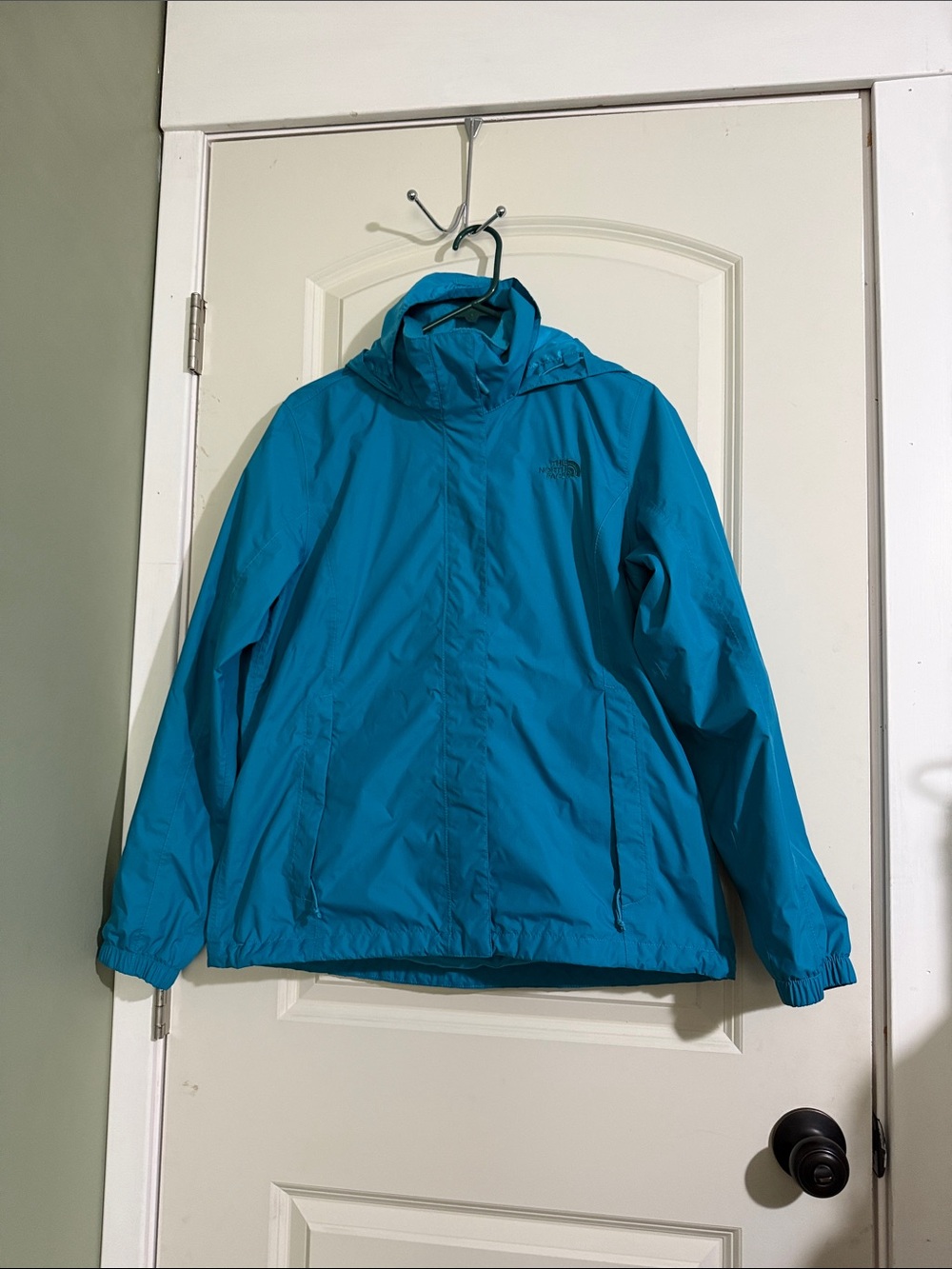 The North Face Teal Hooded Windbreaker Jacket. Womens large.